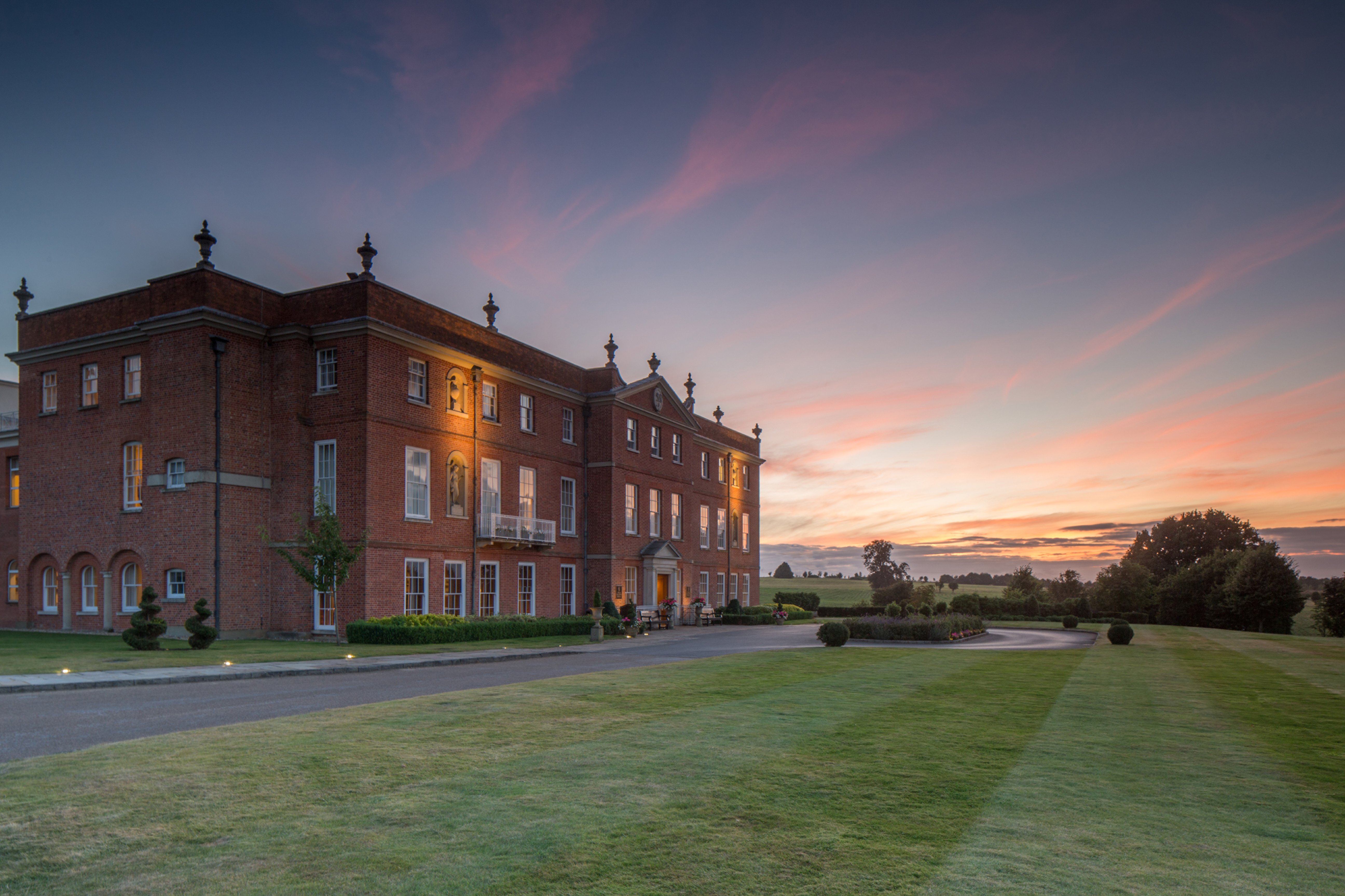 A Four Seasons Hotel Hampshire guest accommodation with the substantial English country-estate interior configuration evocative of the property's specific heritage Georgian-manor identity calibrated to the contemporary Four Seasons luxury standard
