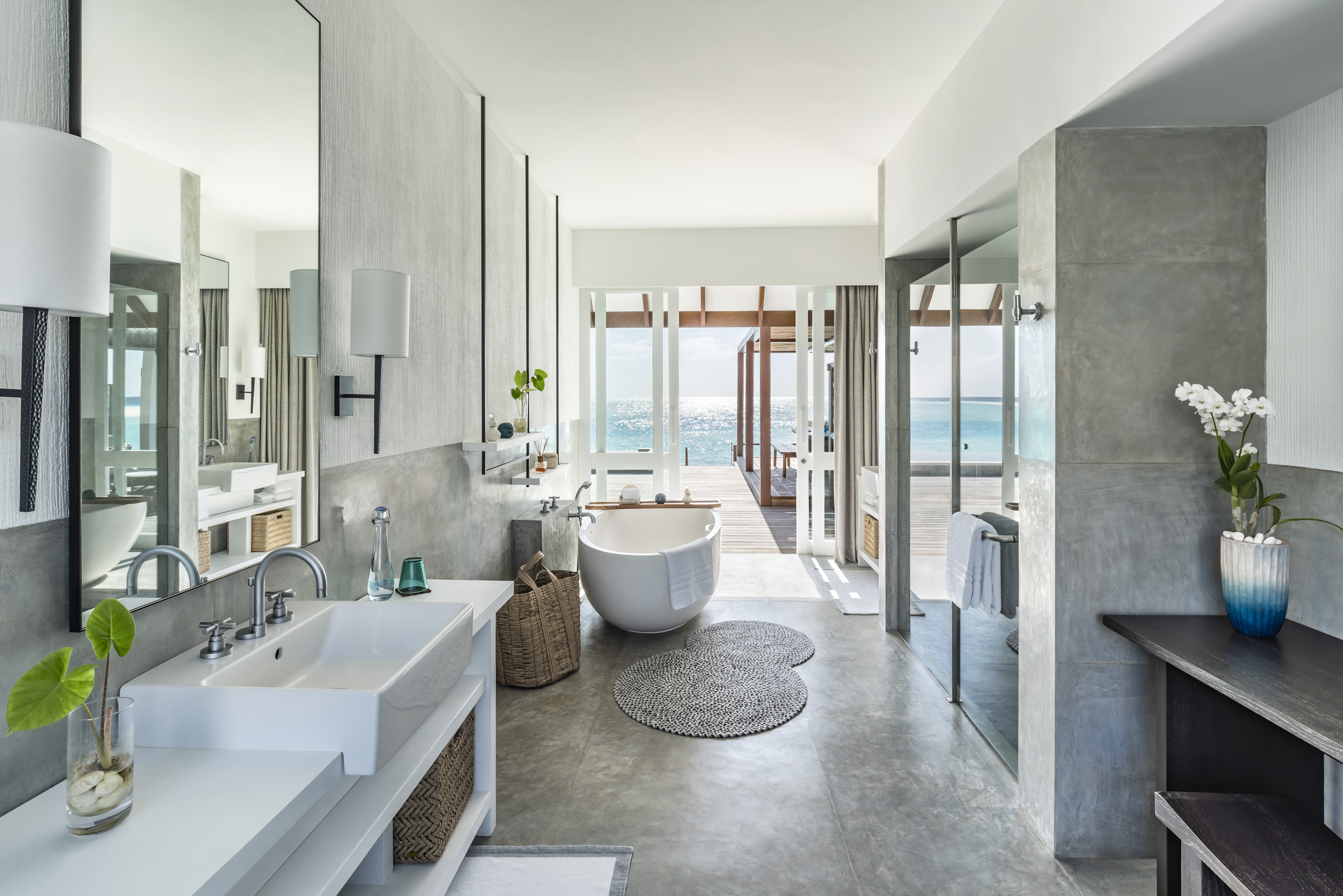 Spa pavilion at Four Seasons Resort Maldives Landaa Giraavaru showing the over-water treatment villa with glass floor for marine views during massage