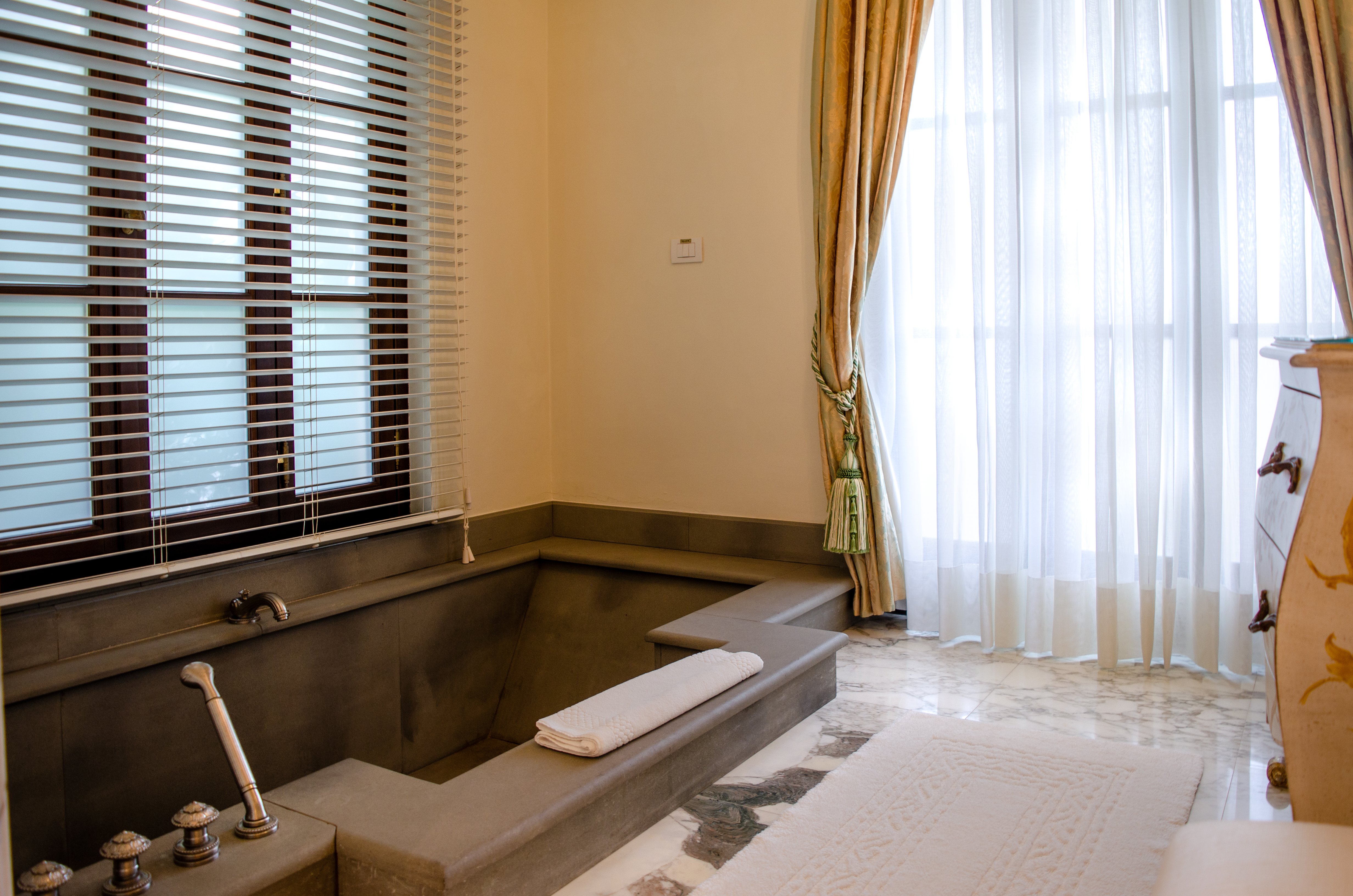 Four Seasons Hotel Firenze guest accommodation with the heritage frescoed-and-stuccoed Renaissance architectural detailing that defines the Palazzo della Gherardesca envelope