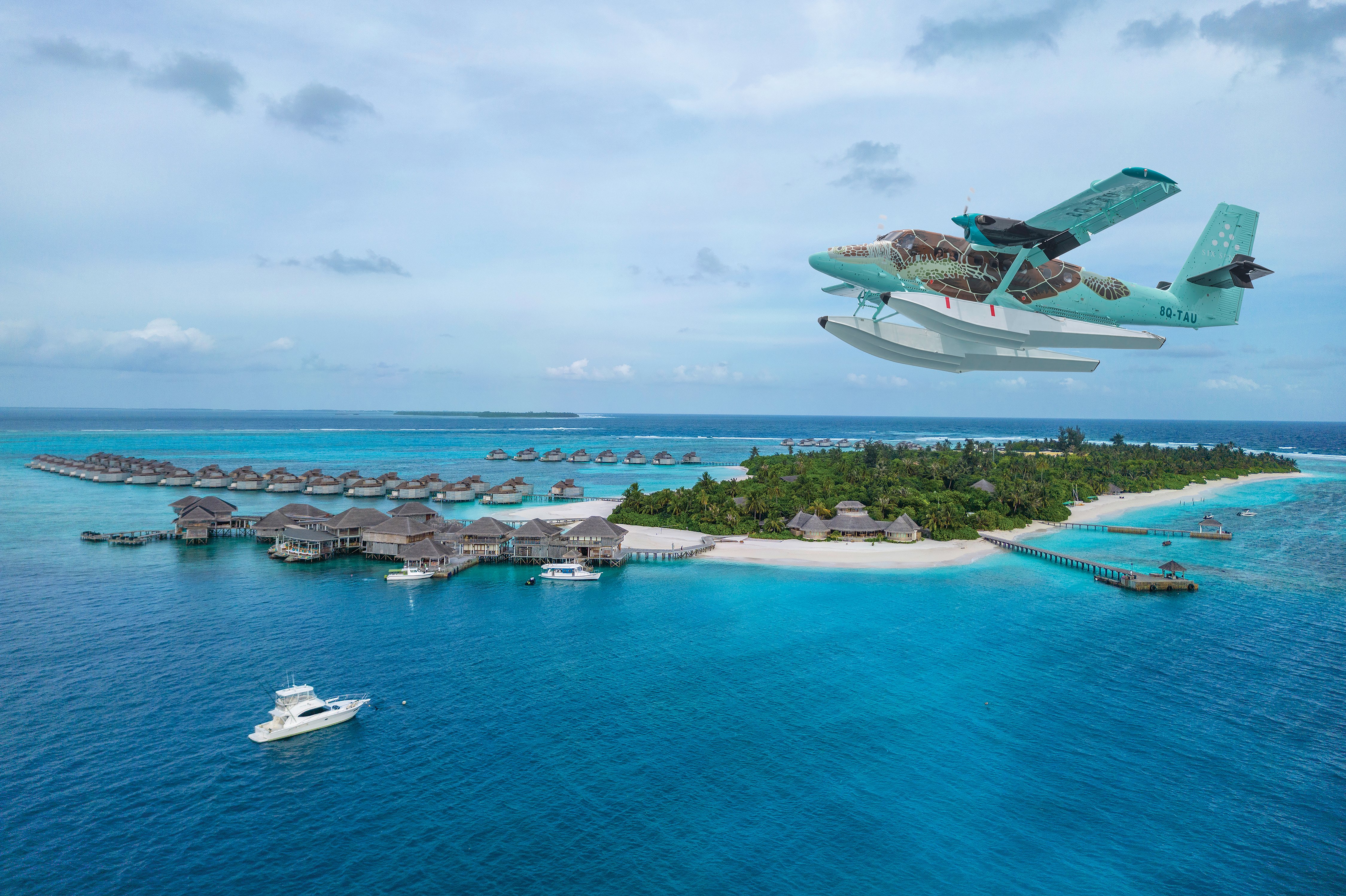 Six Senses Laamu Ocean Water Villa with private deck — the resort's signature overwater accommodation built from sustainably sourced timber
