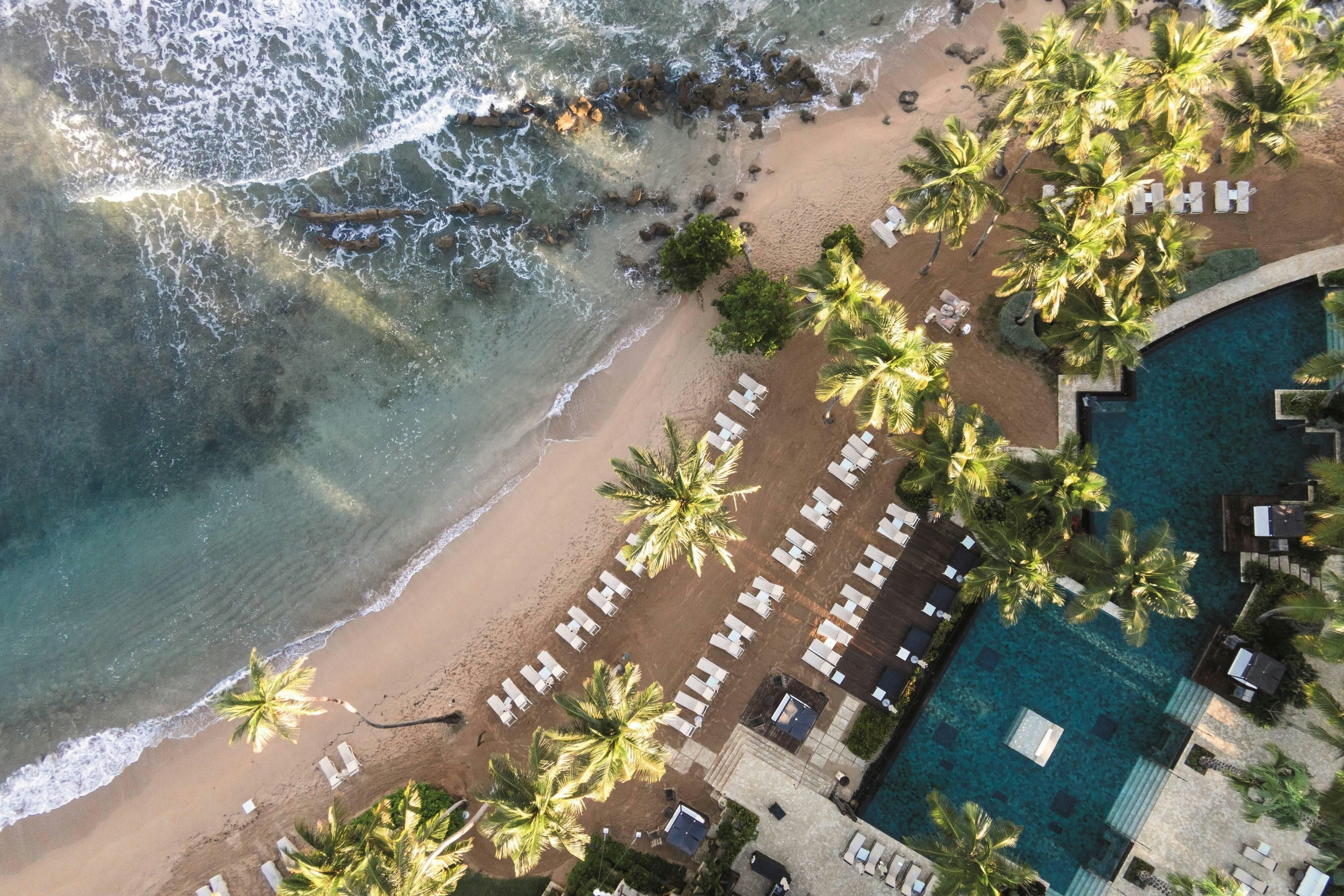 Dorado Beach Ritz-Carlton Reserve oceanfront pool and beach club at sunset