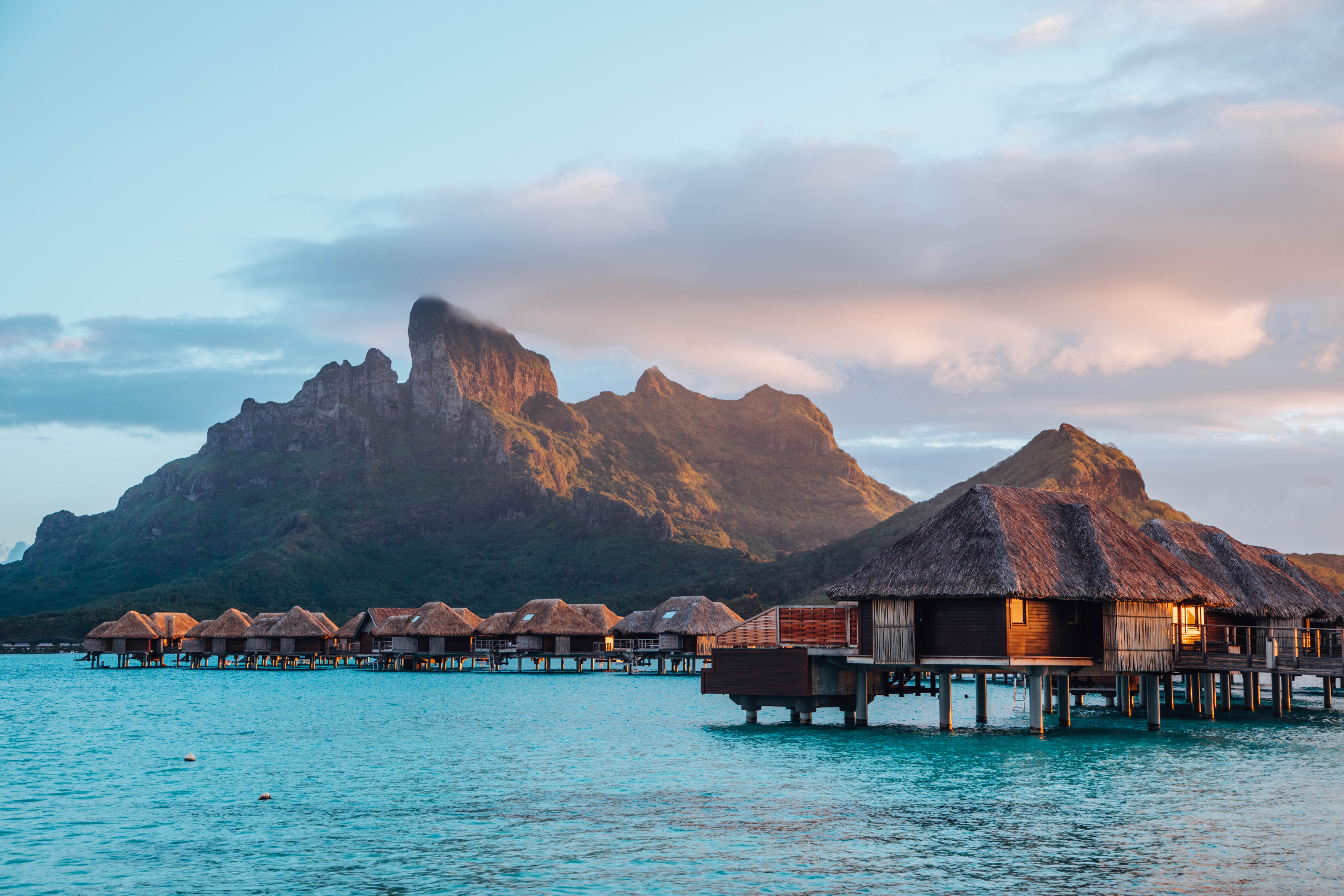 Four Seasons Resort Bora Bora pool deck and lagoon edge with Mount Otemanu in the distance — the property's most photographed daytime amenity