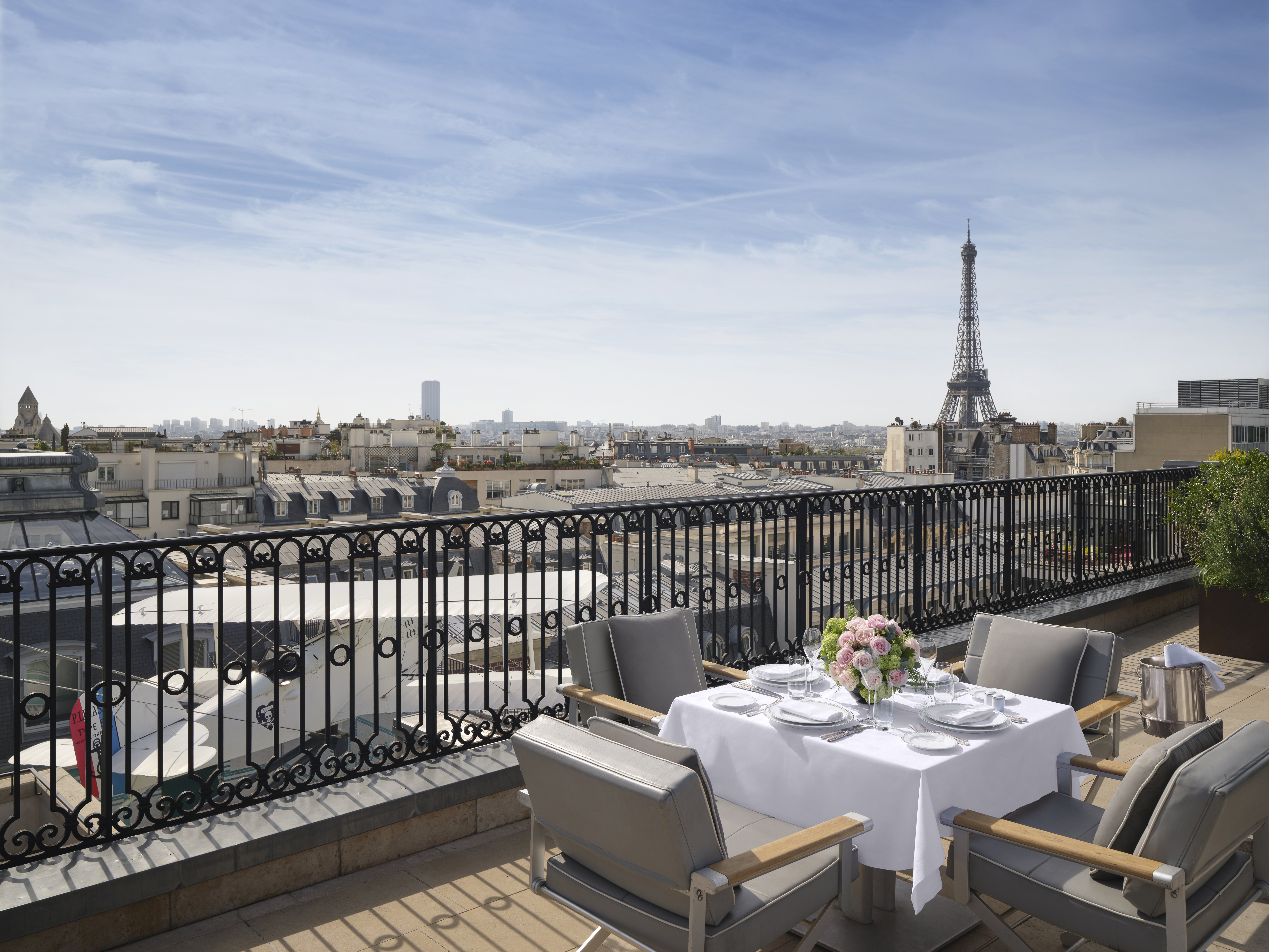 The Peninsula Paris rooftop terrace with the substantial Eiffel Tower view that defines the L'Oiseau Blanc rooftop dining experience and the property's distinctive Paris position