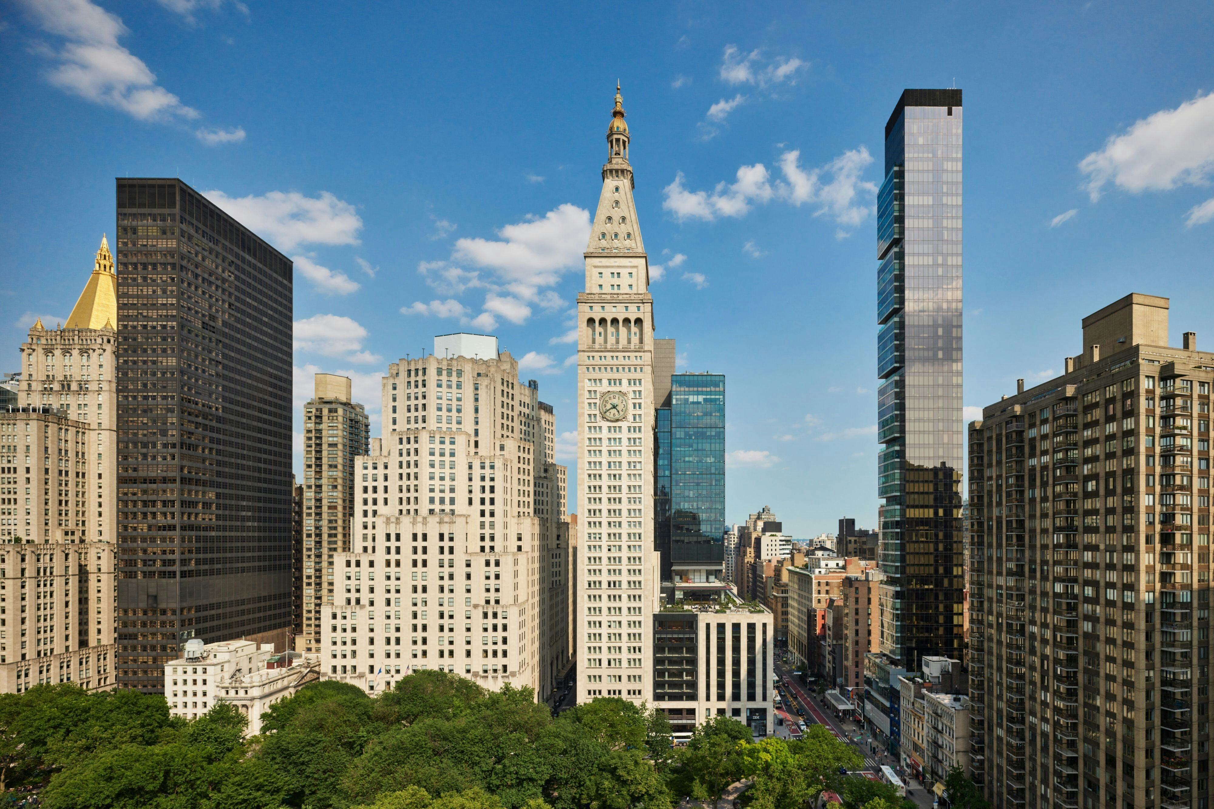 The New York EDITION guest room interior with Yabu Pushelberg contemporary luxury design and the heritage Beaux-Arts architectural detailing that defines the 1909 Metropolitan Life Tower envelope