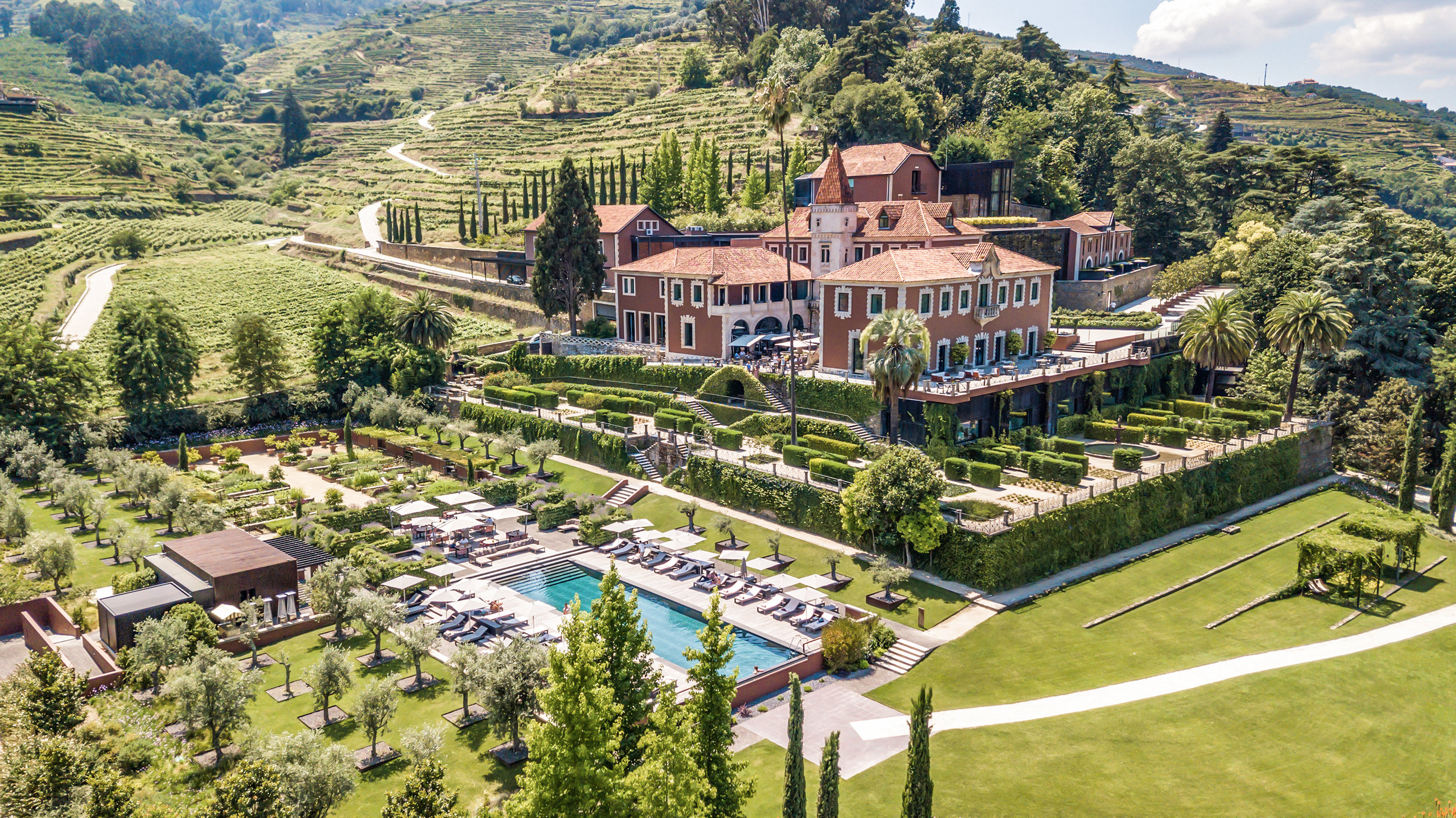 A Six Senses Douro Valley guest accommodation with the substantial Douro River-and-terraced-vineyard orientation and the dedicated heritage-quinta-meets-contemporary-Six-Senses interior configuration that defines the property's specific Portuguese wine-country identity