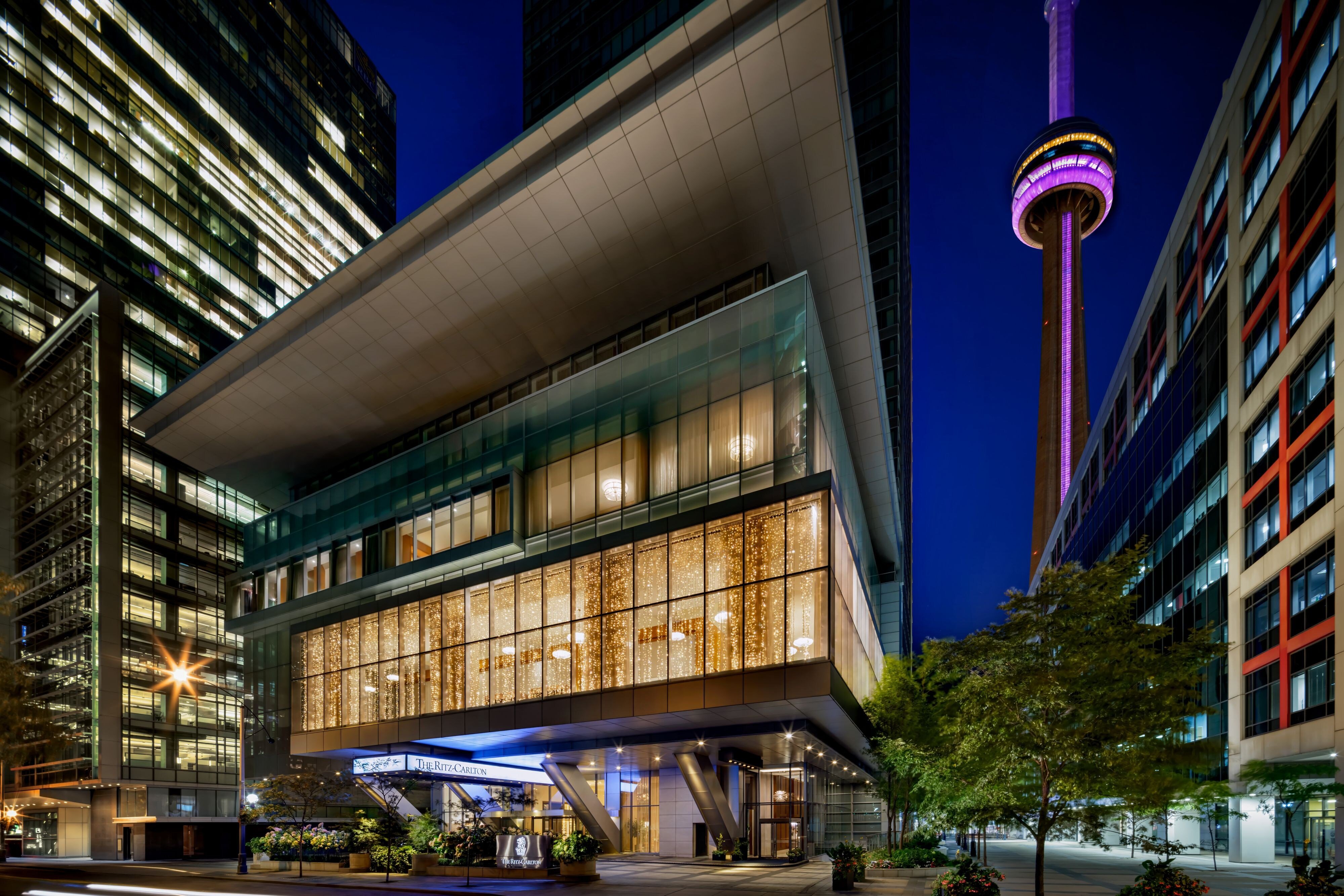 A Ritz-Carlton Toronto guest accommodation with the substantial downtown Toronto and CN Tower orientation and the dedicated contemporary Canadian luxury interior configuration evocative of the property's specific urban luxury identity