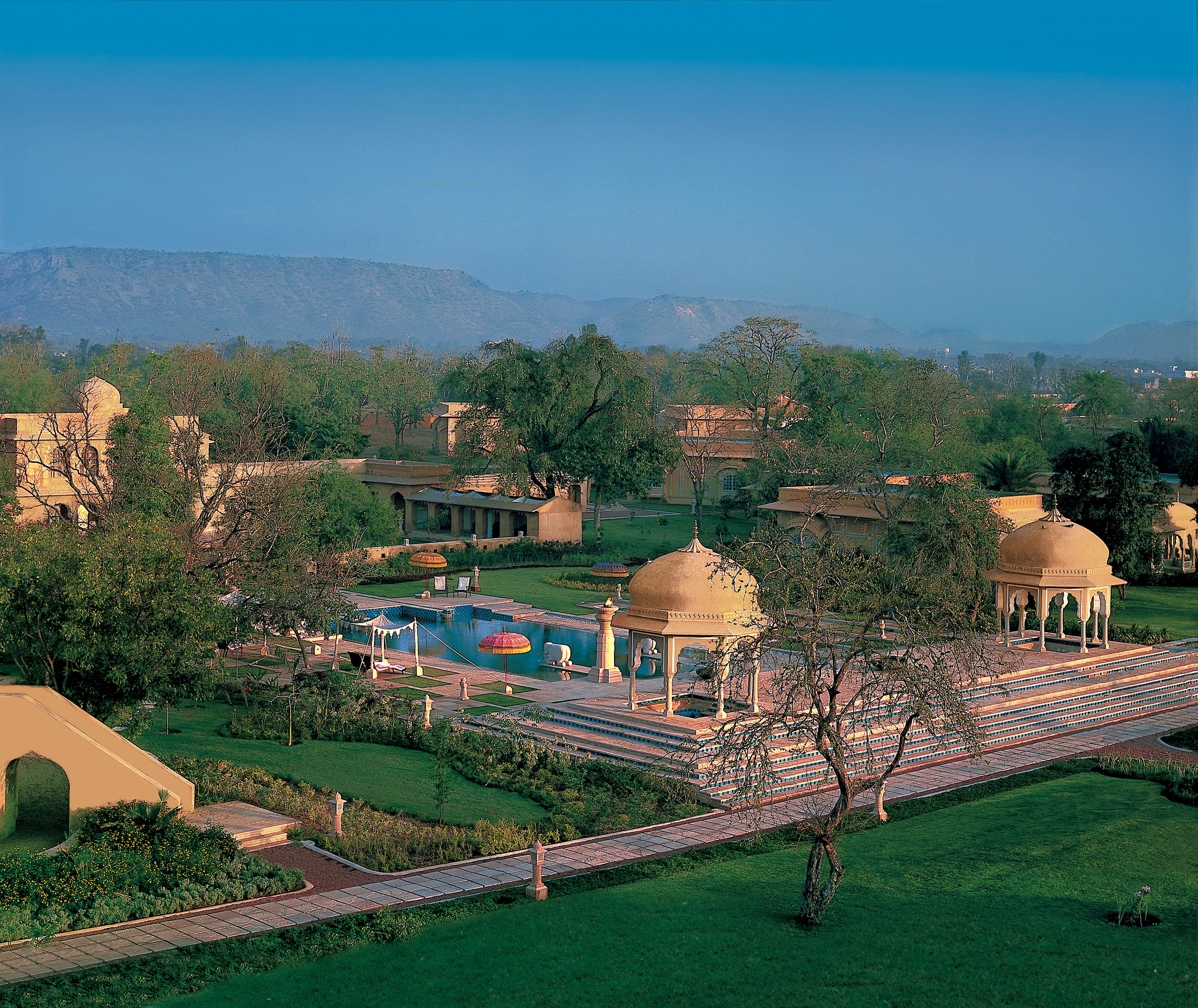The Oberoi Rajvilas dedicated spa and wellness pavilion with the substantial Rajasthani architectural detailing integrated into the 32-acre garden estate