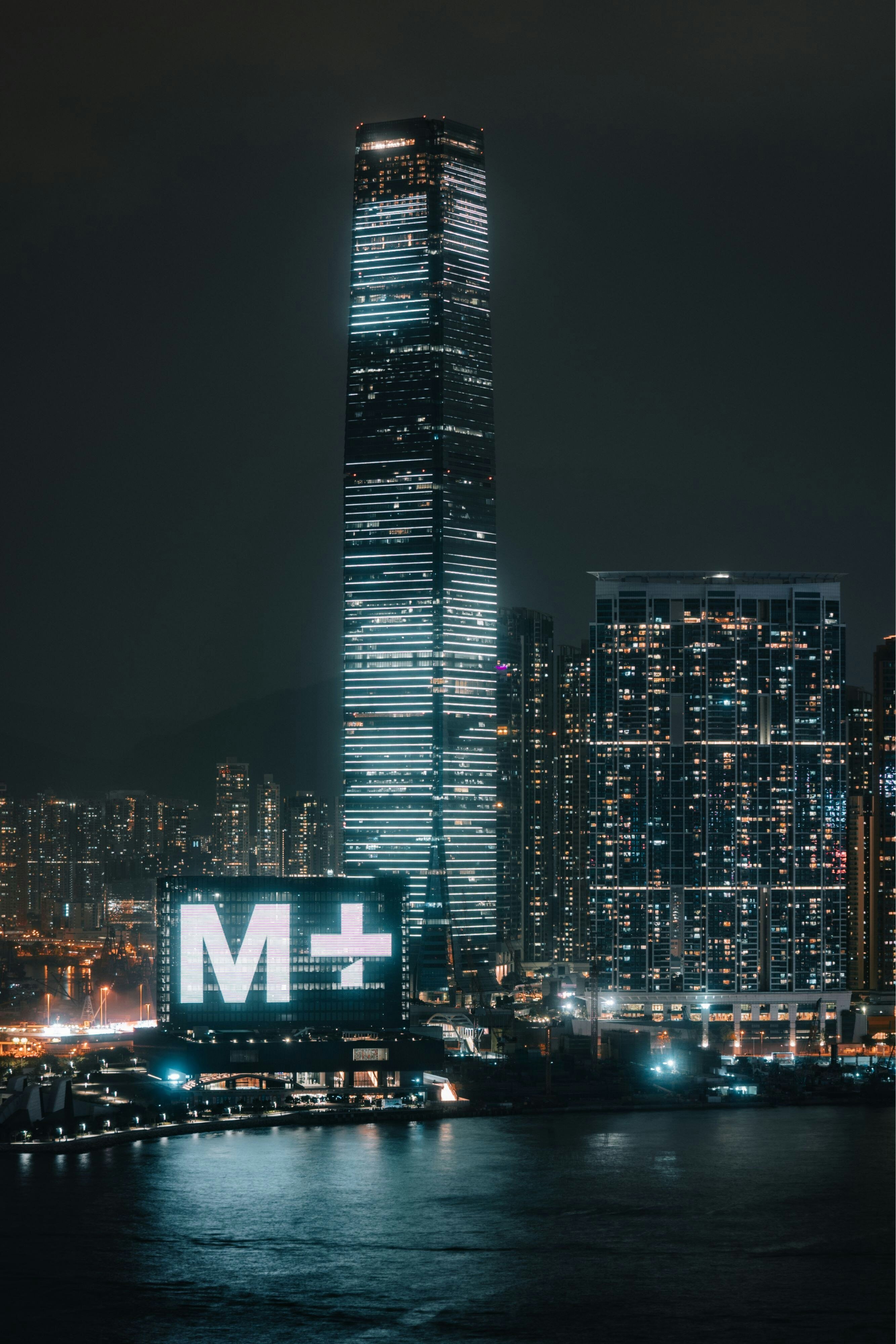 The Ritz-Carlton Hong Kong guest accommodation with the substantial floor-to-ceiling window programming and the unobstructed panoramic Victoria Harbour view from the elevated ICC tower position