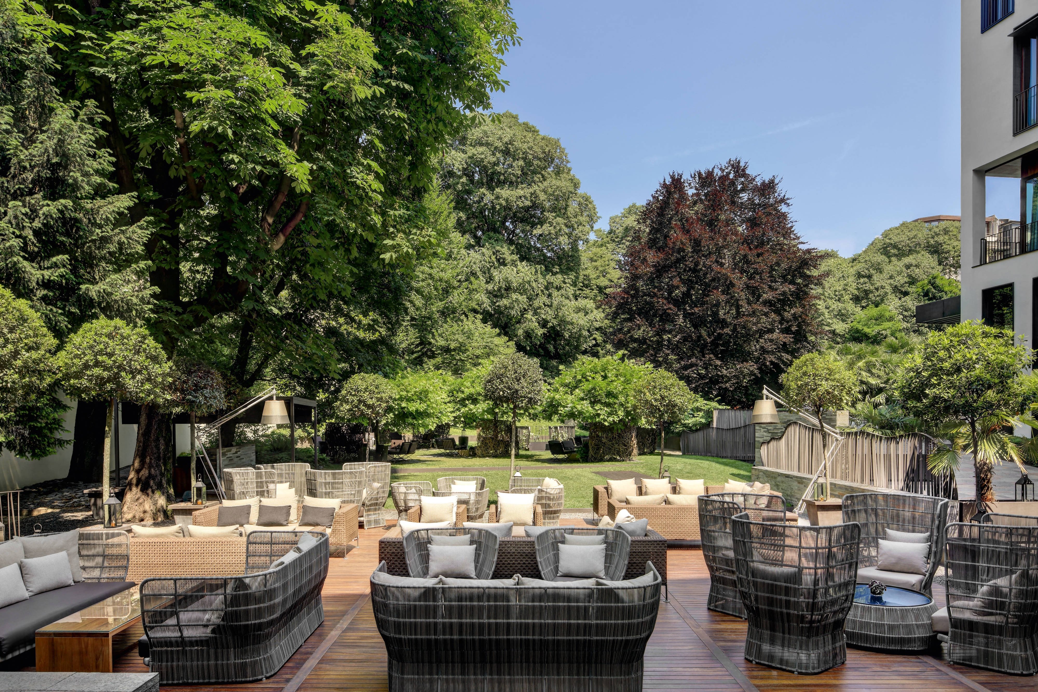 A Bvlgari Hotel Milano guest accommodation with the Citterio-Viel Italian black-and-bronze contemporary luxury interior and the substantial palazzo orientation that defines the foundational Bvlgari Hotels architectural identity