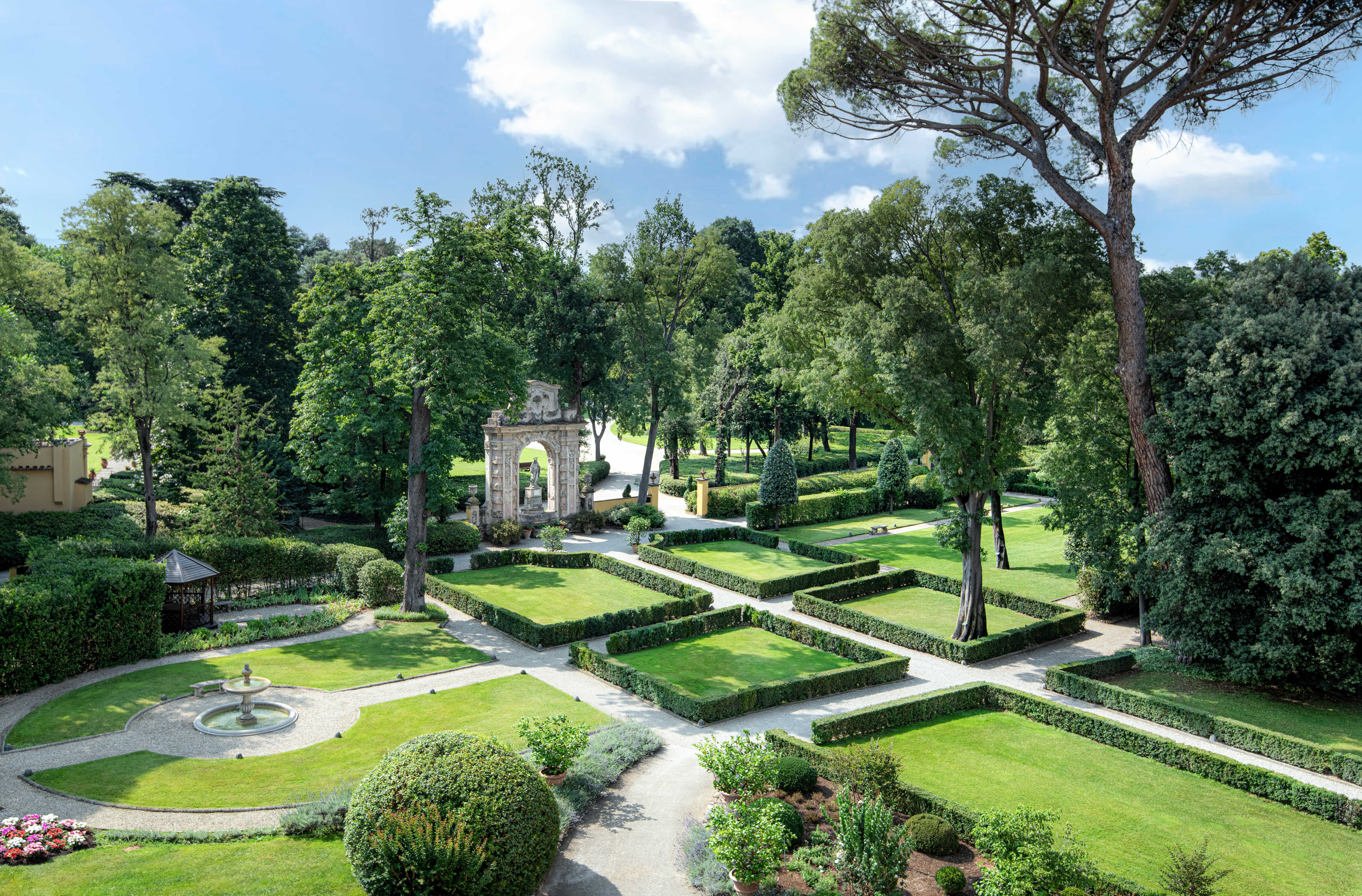 The 11-acre Giardino della Gherardesca Renaissance garden at Four Seasons Hotel Firenze with the dedicated outdoor swimming pool and the substantial centuries-old landscape