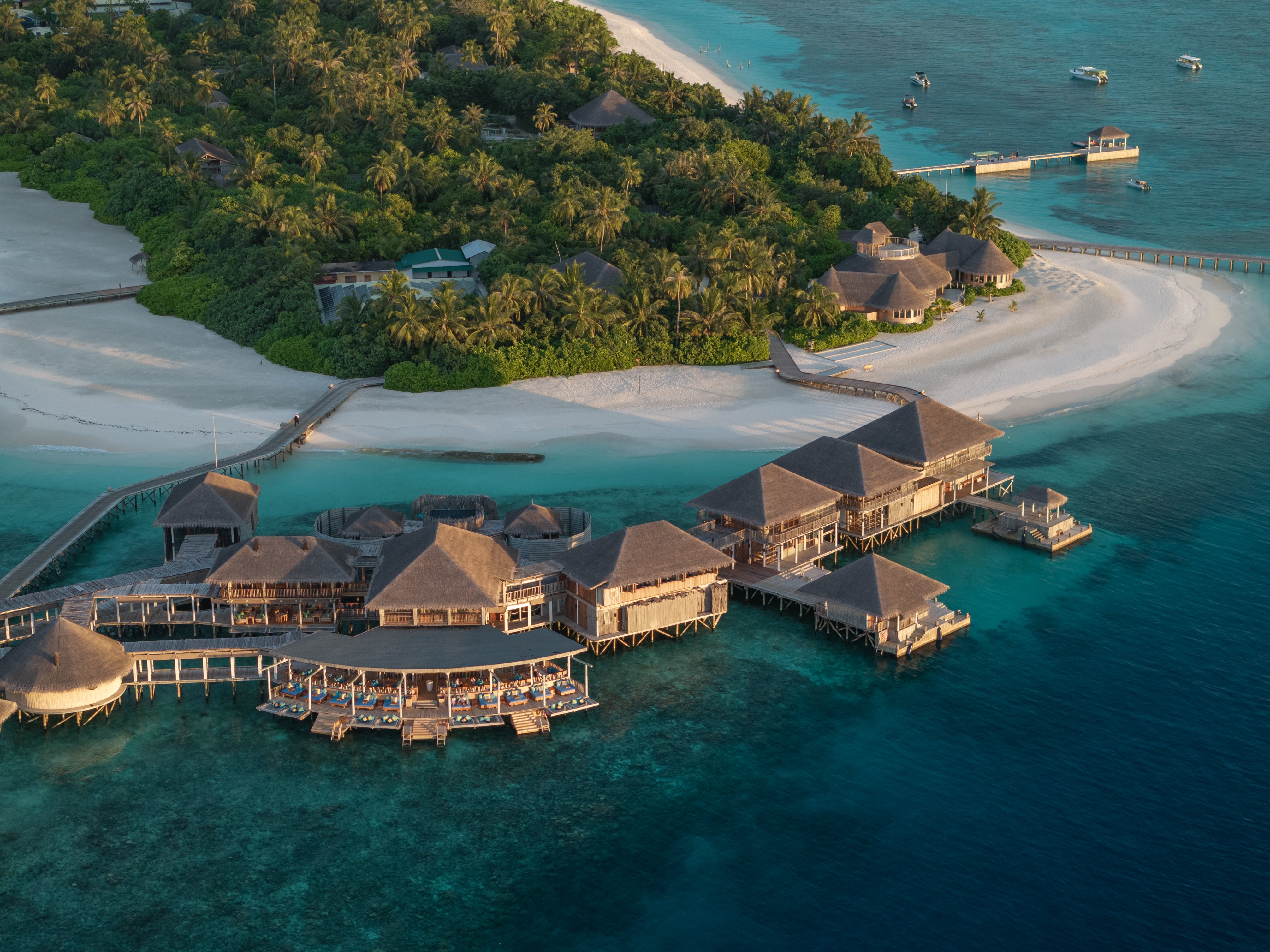 Six Senses Laamu open-air dining venue with views of the Indian Ocean — one of the resort's restaurants featuring the organic kitchen garden's produce