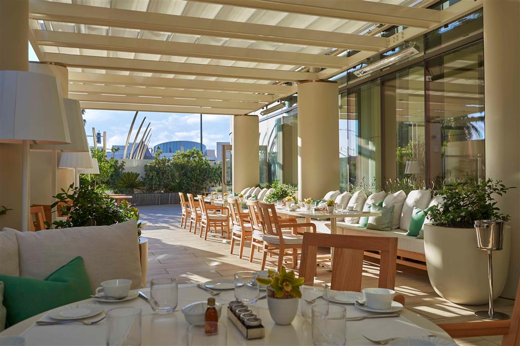 Waldorf Astoria Beverly Hills rooftop pool with panoramic view across Beverly Hills to the Hollywood Hills — the most photographically distinctive Los Angeles luxury hotel rooftop position