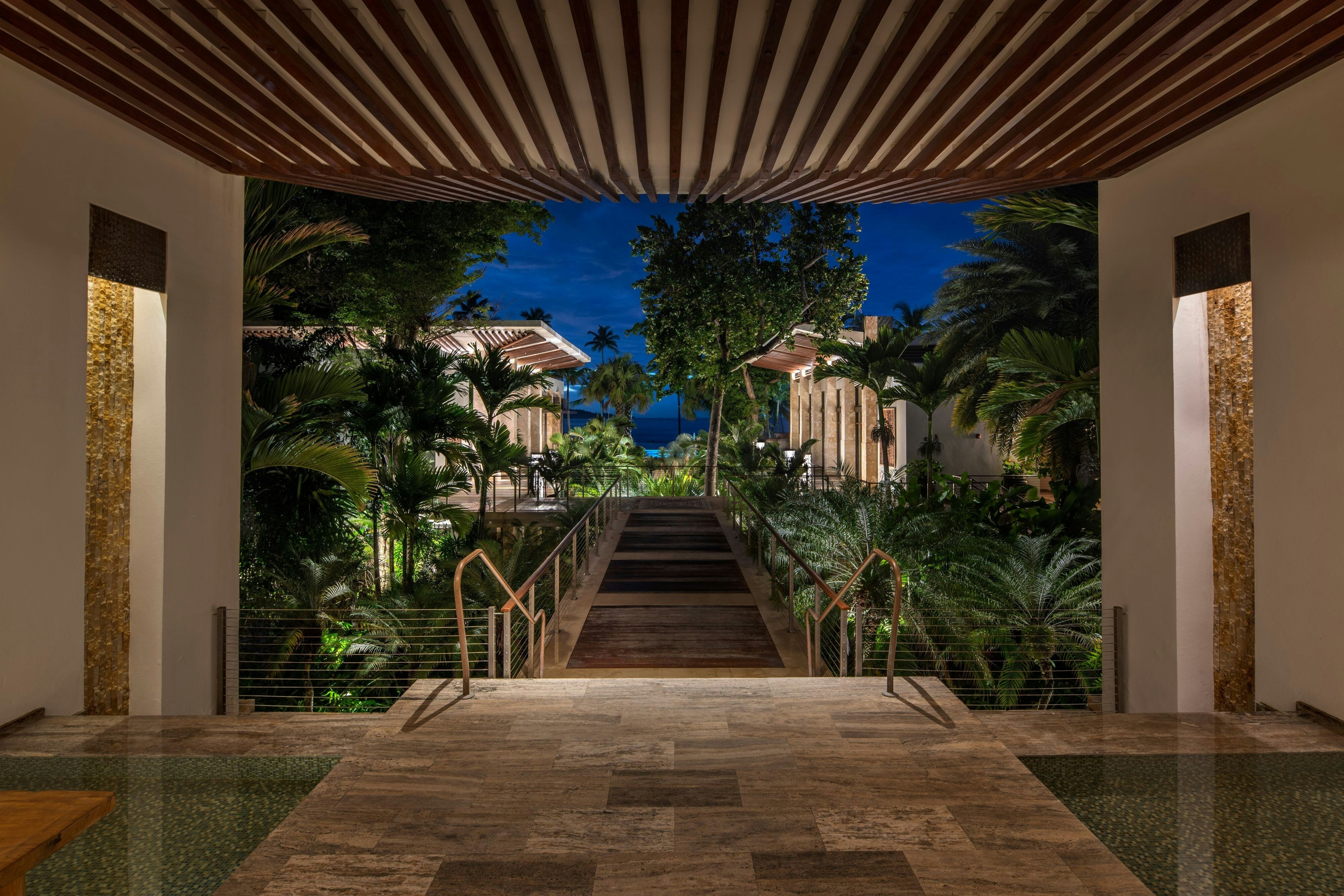 Spa Botanico at Dorado Beach Ritz-Carlton Reserve showing outdoor treatment cabanas surrounded by tropical foliage